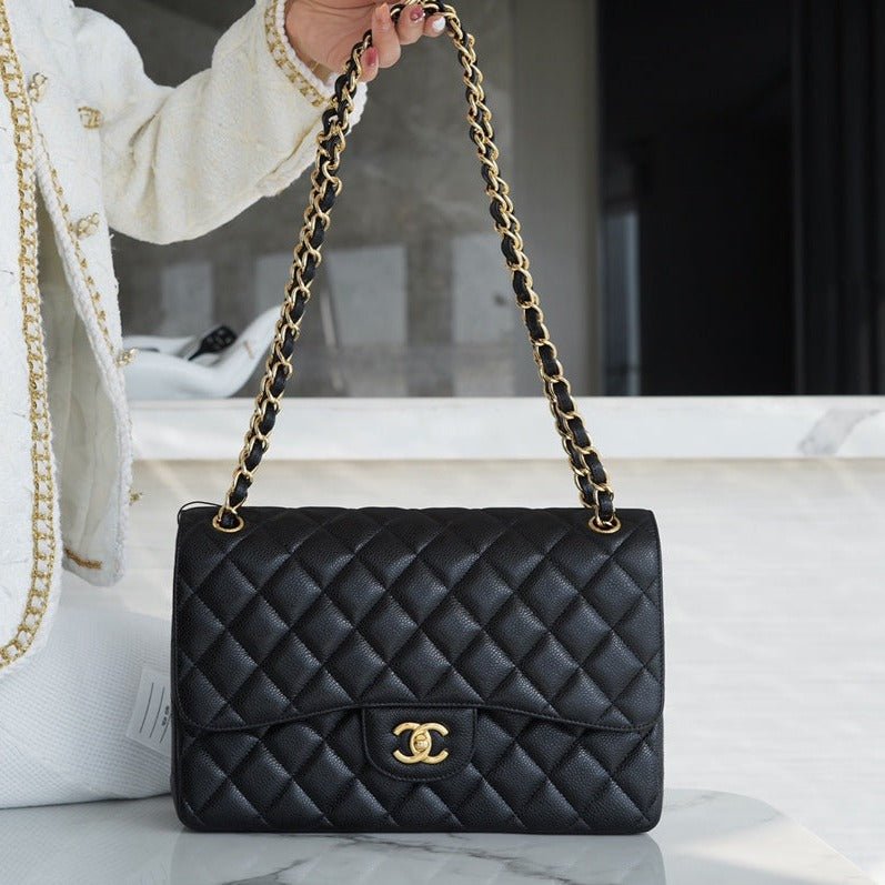 13339527256172943_fec7ac59-265e-4124-8710-07d69a40724a FLAP BAG JUMBO 30CM GOLD HARDWARE BLACK CAVIAR - Image 1