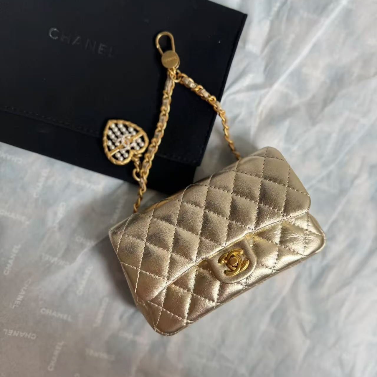 Image_20250819163338_1103 CC CLASSIC FLAP BAG 13 IN GOLD LAMBSKIN WITH PEARL HEART CHARM - Image 1