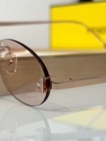 FIRST CRYSTAL RIMLESS OVAL FRAME SUNGLASSES FE4075US IN METAL - Image 8
